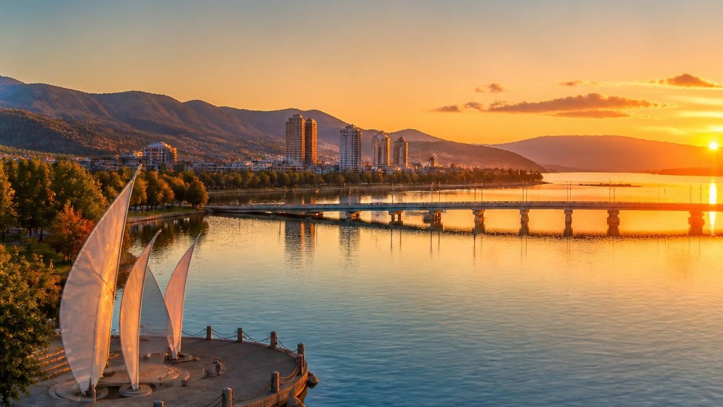 Golden light over Okanagan Lake and Kelowna’s waterfront from the Townline collection