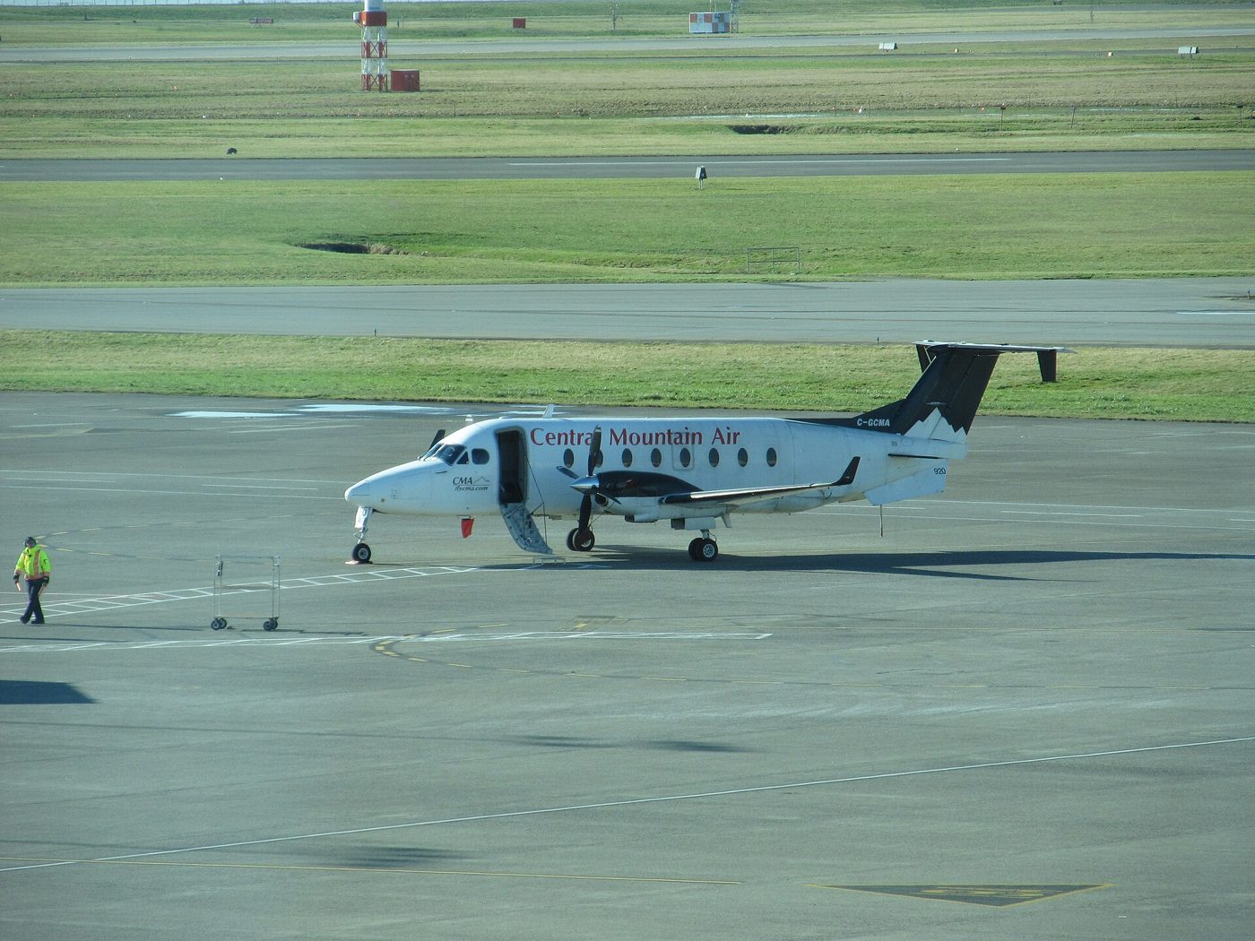 A turboprop aircraft on the tarmac at Vancouver International Airport
