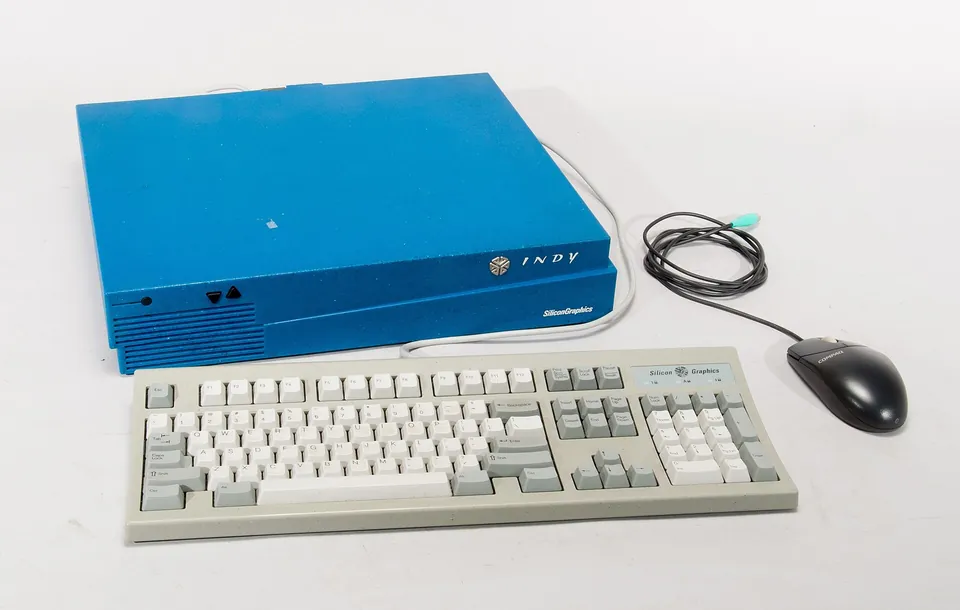 A blue Silicon Graphics Indy workstation with keyboard and mouse