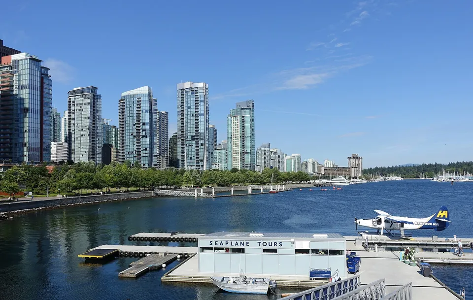 Downtown Vancouver towers and a seaplane at Coal Harbour