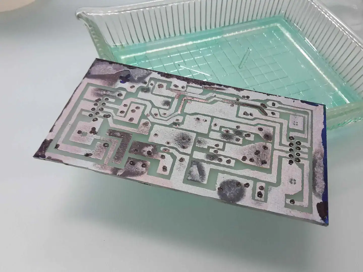 After etching of the circuit board the uncovered copper surfaces have gone