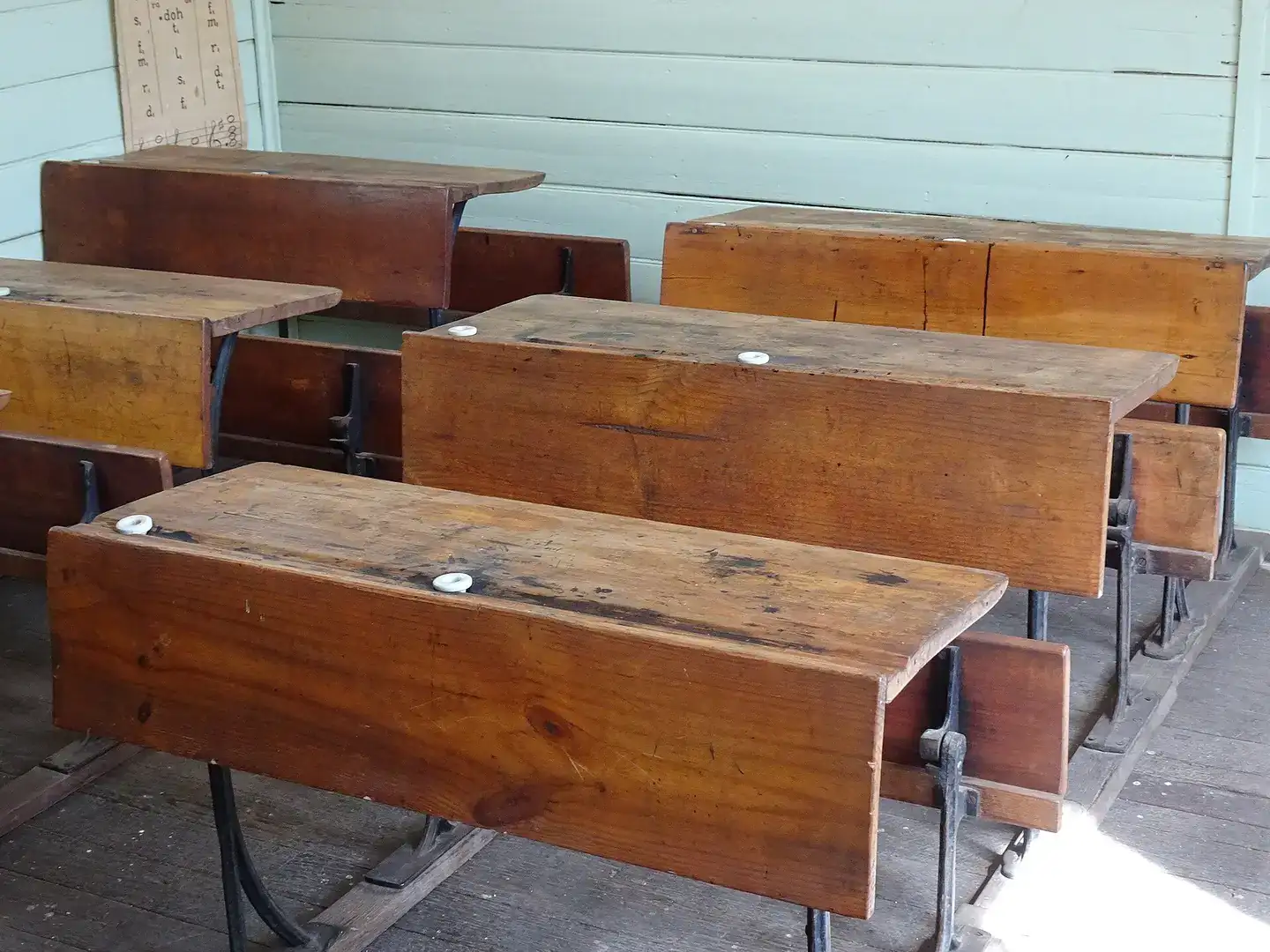 Basic desks in a historic classroom at Loxton Historical Village, South Australia
