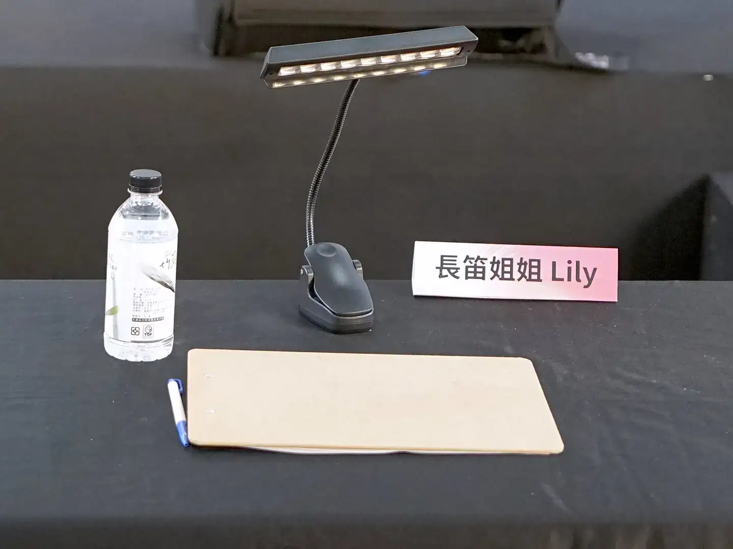 Ballpoint pen and clipboard on Lily Cao's desktop 20250222