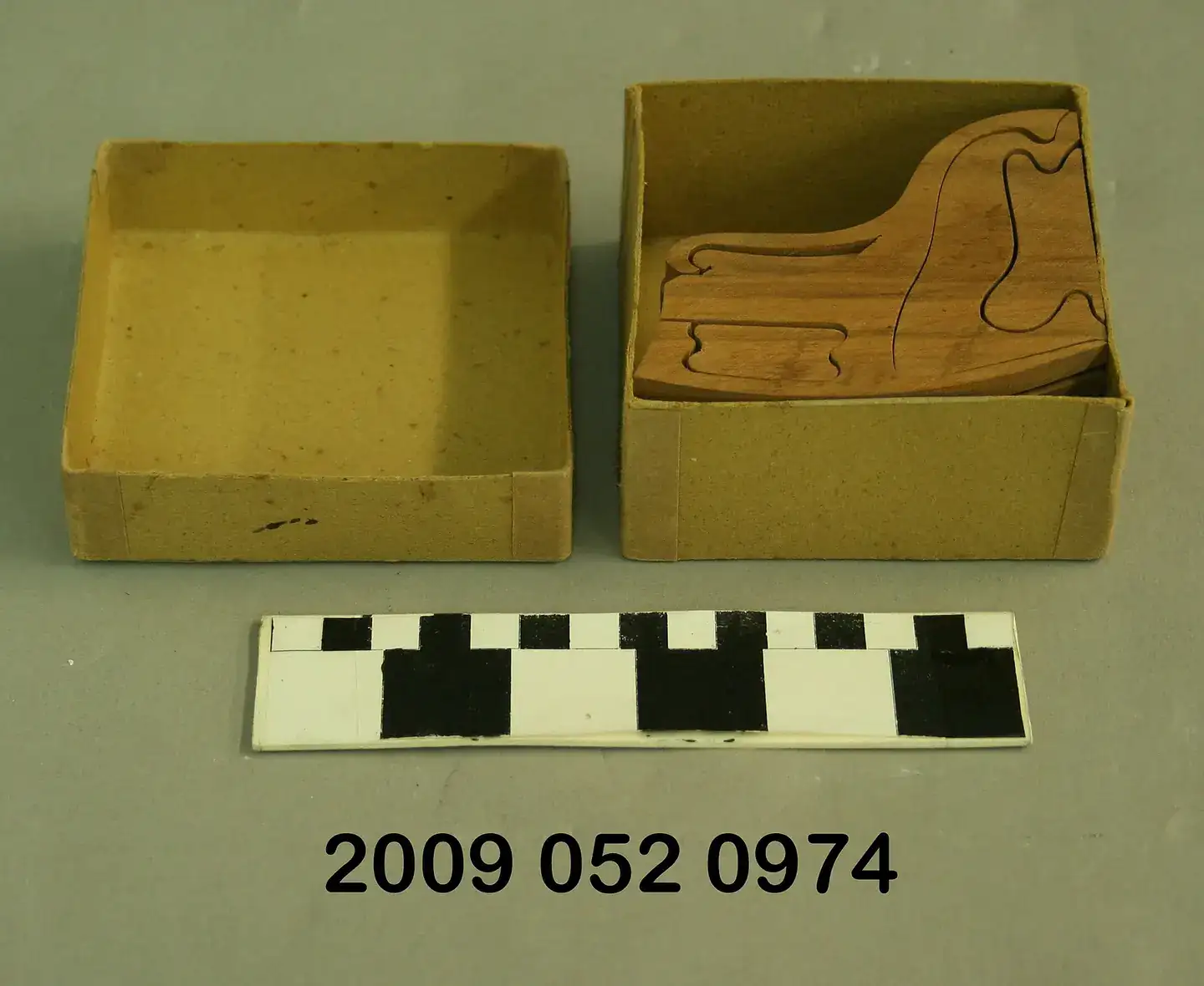 A wooden 3D puzzle in its original box