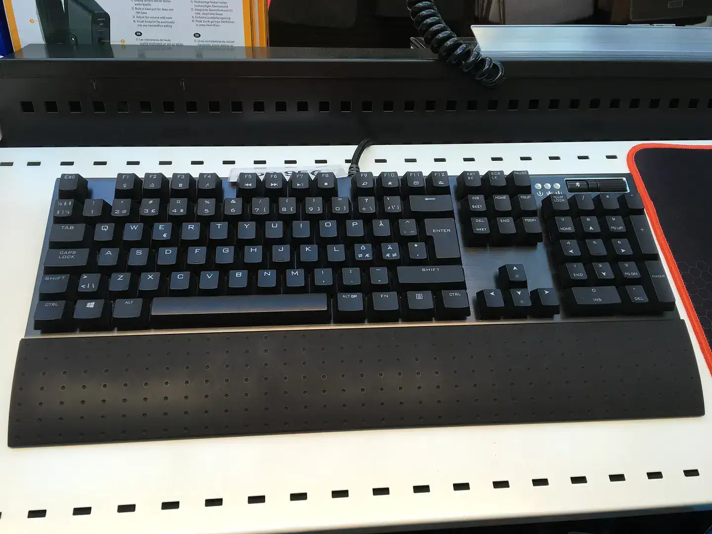 A computer keyboard on a desk