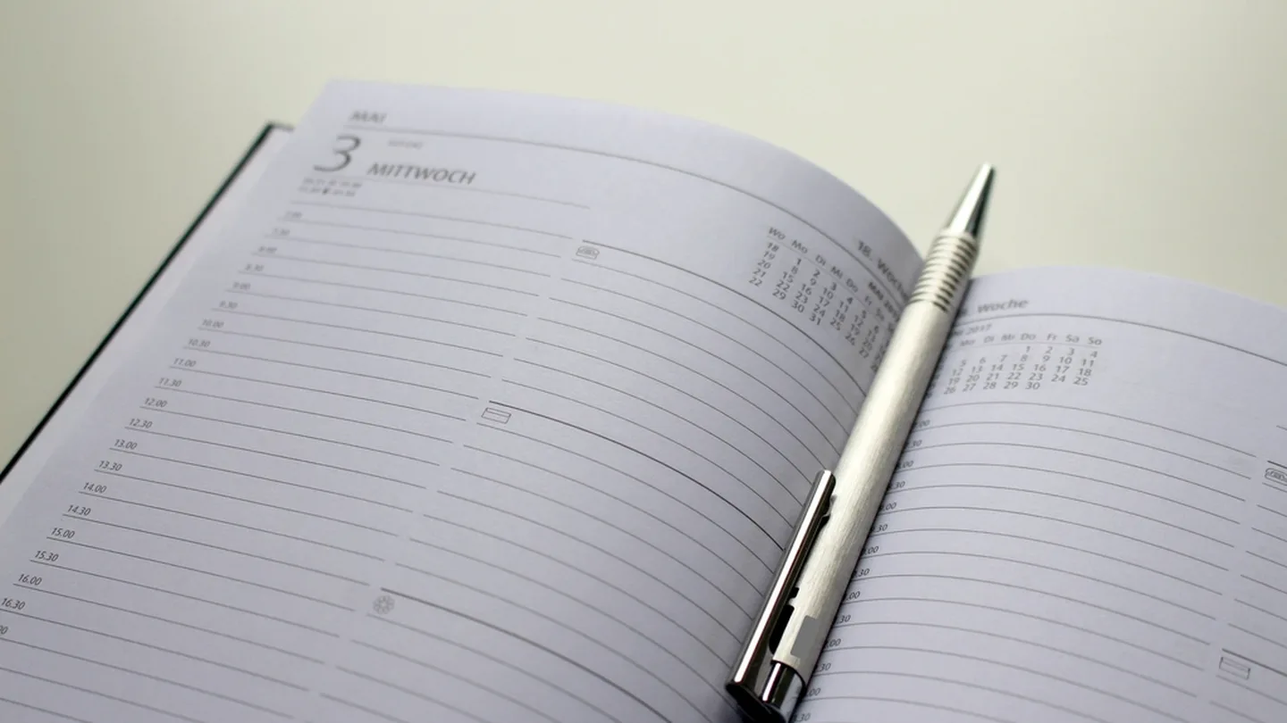 An open planner and pen ready for a thirty-day plan