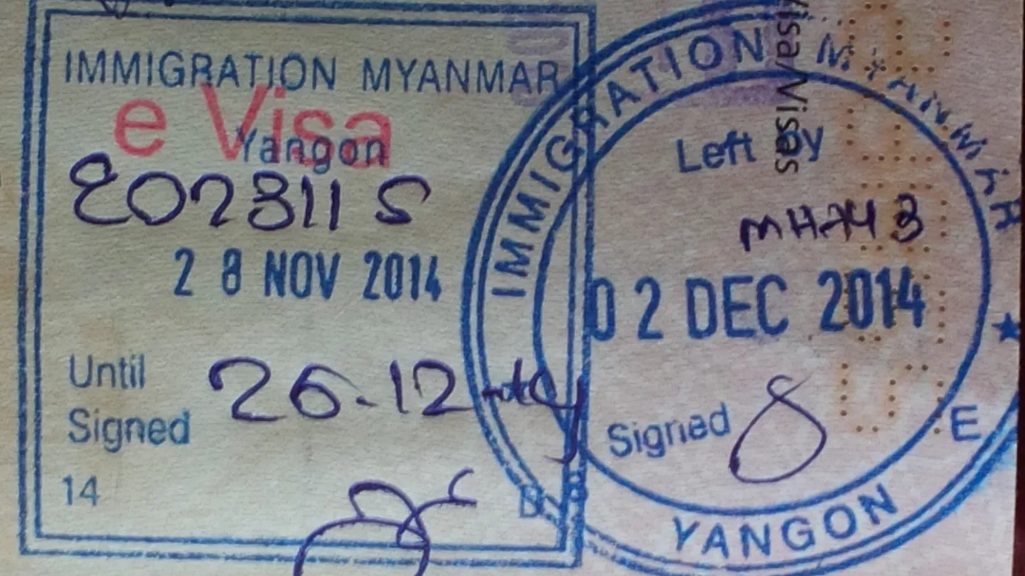 Immigration entry and exit stamps in a passport