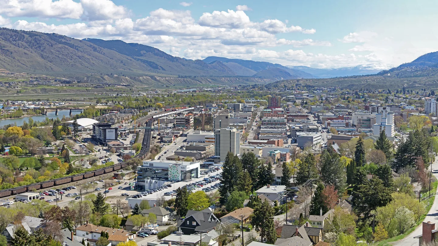 Downtown Kamloops and the Thompson River valley seen from the hillside on a spring day
